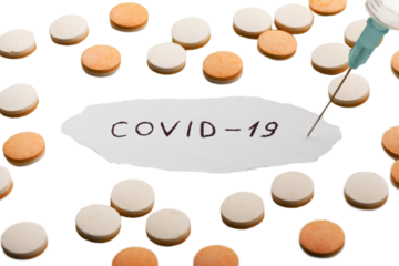 Coronavirus disease named covid 19 handwriting on paper with pill