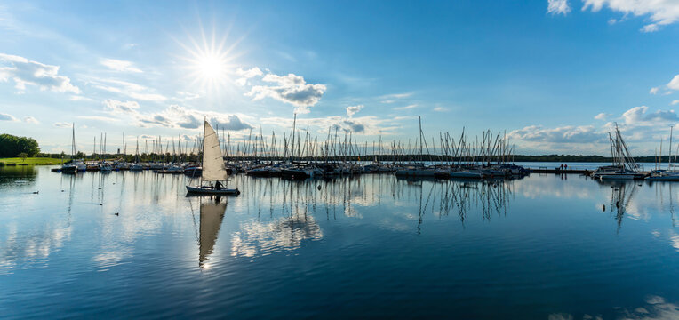 Markkleeberg, Germany - September 22 2022: A Sailboat at the harbor of the Cospudener Lake near Leipzig while the sun shines