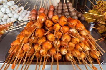 Asian fast junk food at Thailand street. Balls from meat, fish, sea food