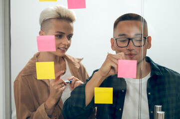 Office worker sharing ideas with his coworker