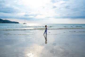 Time to relax in summer lifestyle outdoor shot on tropical island beach Summer time woman vacation on the beach middle-aged woman leisure walk feeling free on seaside beach