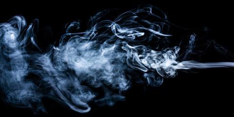 Smoke on an isolated black background. Studio macro photography. Close-up .