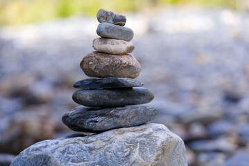 Close-up of pile of stones at river bank of Rhine River at Anterior Rhine Valley on a sunny autumn day at Versam Station, Canton Graubünden. Photo taken September 26th, 2022, Versam, Switzerland.