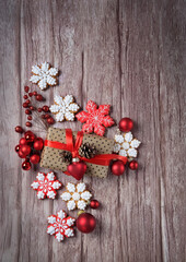 Christmas decorations, gift box and gingerbread snowflakes cookies on wooden table. Christmas holiday background. festive winter season. top view. copy space