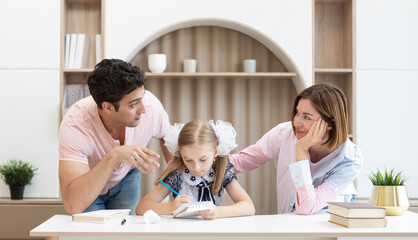 Portrait of happy family with child daughter studying at home. Home education and parents support concept	