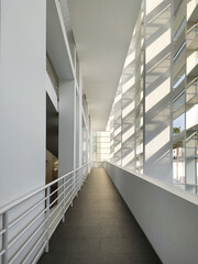 atrium of a public building on three floors with white balconies