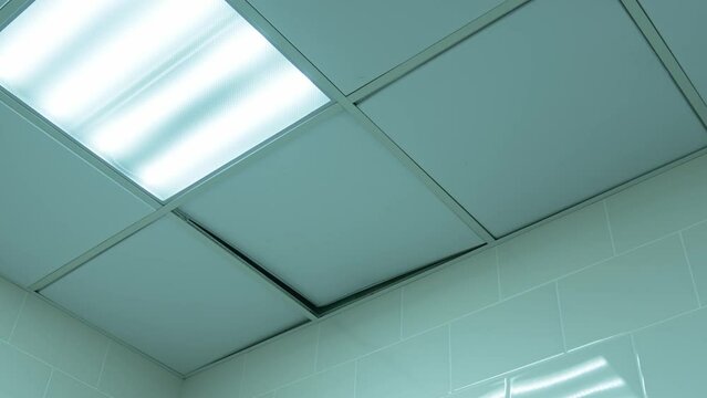 ceiling tiles on the ceiling move from the wind.