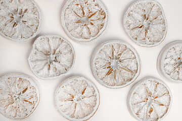 pattern of dried round white oranges on a white background. for labels, signs, postcards, announcements and more