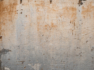 Scratched and cracked peeling damaged concrete wall texture background