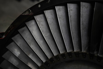 A turbine in a low key. Steel turbine blades. Selective focus.