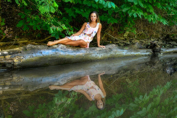 Photographs of Mandy swinging, in water, splashing ion Cheat Lake