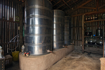 Naklejka na ściany i meble Steel barrels with cachaca, the Brazilian drink on industry