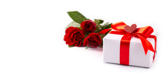 White gift box and red roses on the white background, Valentine's or mother's day card