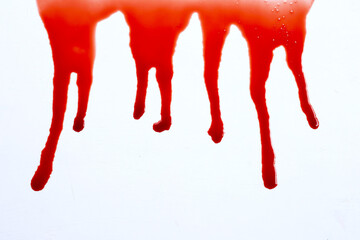 Drops of blood on white background.