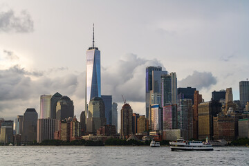 Fototapeta na wymiar The financial district in the lower Manhattan in New York City with stormy clouds in background.