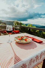 Pizza margarita with wine in a restaurant