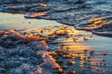 Close-up of ice on the beach at sunset. Pörkenäs, Österbotten/Pohjanmaa. Finland.