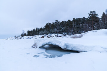 Snow covered beach and frozen sea. Pörkenäs, Österbotten/Pohjanmaa. Finland