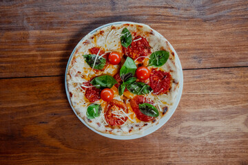 Pizza margarita with wine in a restaurant