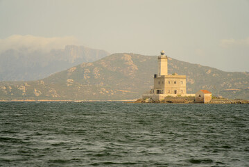Isola della Bocca lighthouse in Olbia, Italy seen from the see on a sunny day