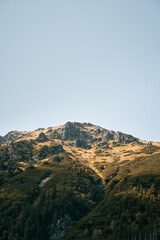 Rocky peak of the mountain. Sunny day in the European mountains.