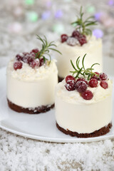 Mousse cakes with coconut cream and Greek yogurt over chocolate cake are the perfect dessert. Add whipped cream and berries. Treat friends and loved ones on Christmas or New Year's Eve