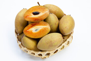 Fresh sapodilla fruit on white background