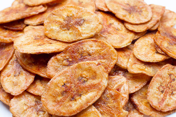 Banana chips on white background