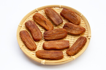 Sun dried bananas on white background.