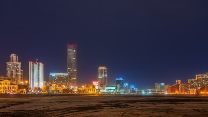 Yekaterinburg city with Buildings of Regional Government and Parliament, Dramatic Theatre, Iset Tower, Yeltsin Center, panoramic view at Early Spring night