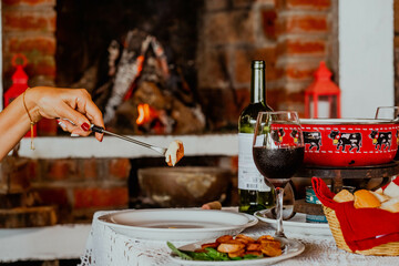 Fondue in a cozy wooden cabin