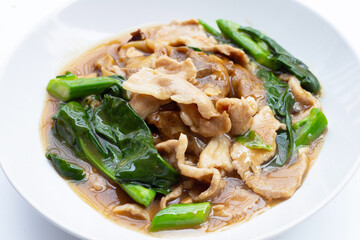 Fried flat noodle with pork and kale in gravy sauce