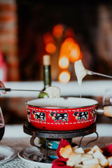 Fondue in a cozy wooden cabin