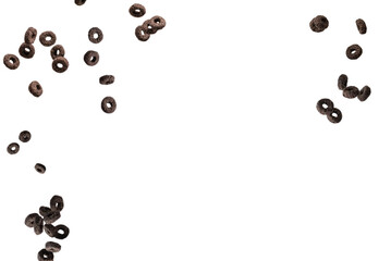 Chocolate rings cereal spill out into a bowl. Breakfast.