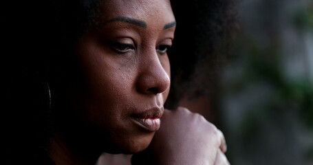Sad pensive black woman close-up face feeling depressed and preoccupied-1