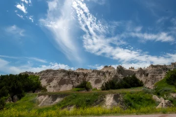 Foto op Canvas The rugged mountains of the Badlands. These geologic deposits contain one of the world’s richest fossil beds. Ancient mammals such as the rhino, horse, and saber-toothed cat once roamed here © dfriend150