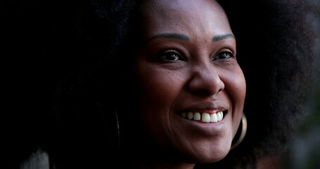 Positive African woman smiling. Black person portrait face close-up