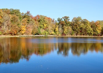 The peaceful lake in the country on a sunny autumn day.