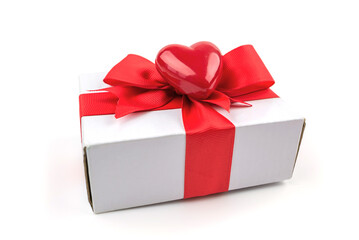  gift box with a red ribbon and a red heart on a white background.