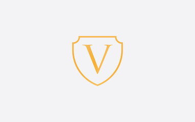 Shield protection symbol and royal luxury shield monogram design. shield protection logo with letter V