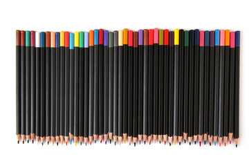 Colored pencils lined up on white background. Color pencils isolated on white. Copy space.