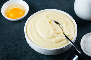 Glass jar with vanilla pudding. Custard cream. Traditional cream