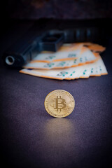 Bitcoin and a gun on euro paper money
