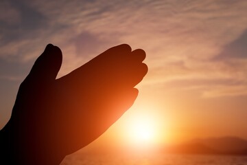 Person hands worship to god outdoor