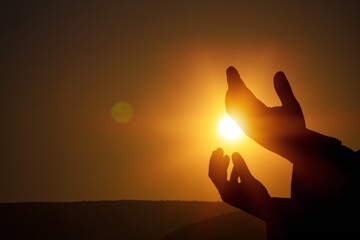 Person hands worship to god outdoor