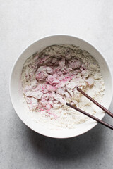 Dry noodles dough, pink beet noodles, homemade noodles, process of making noodles, dough in white bowl