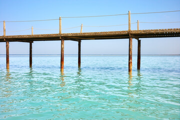 Picture of a wooden pier, tropical summer vacation concept.