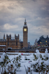 Beautiful view of the snow covered Big Ben clocktower at Westminster, London, England, on a cold...