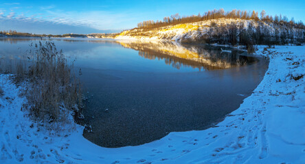 The first ice on the pond in the early frosty morning.