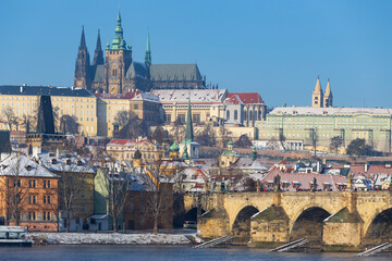 Snowy Prague Lesser Town with Prague Castle above River Vltava in the sunny Day , Czech republic